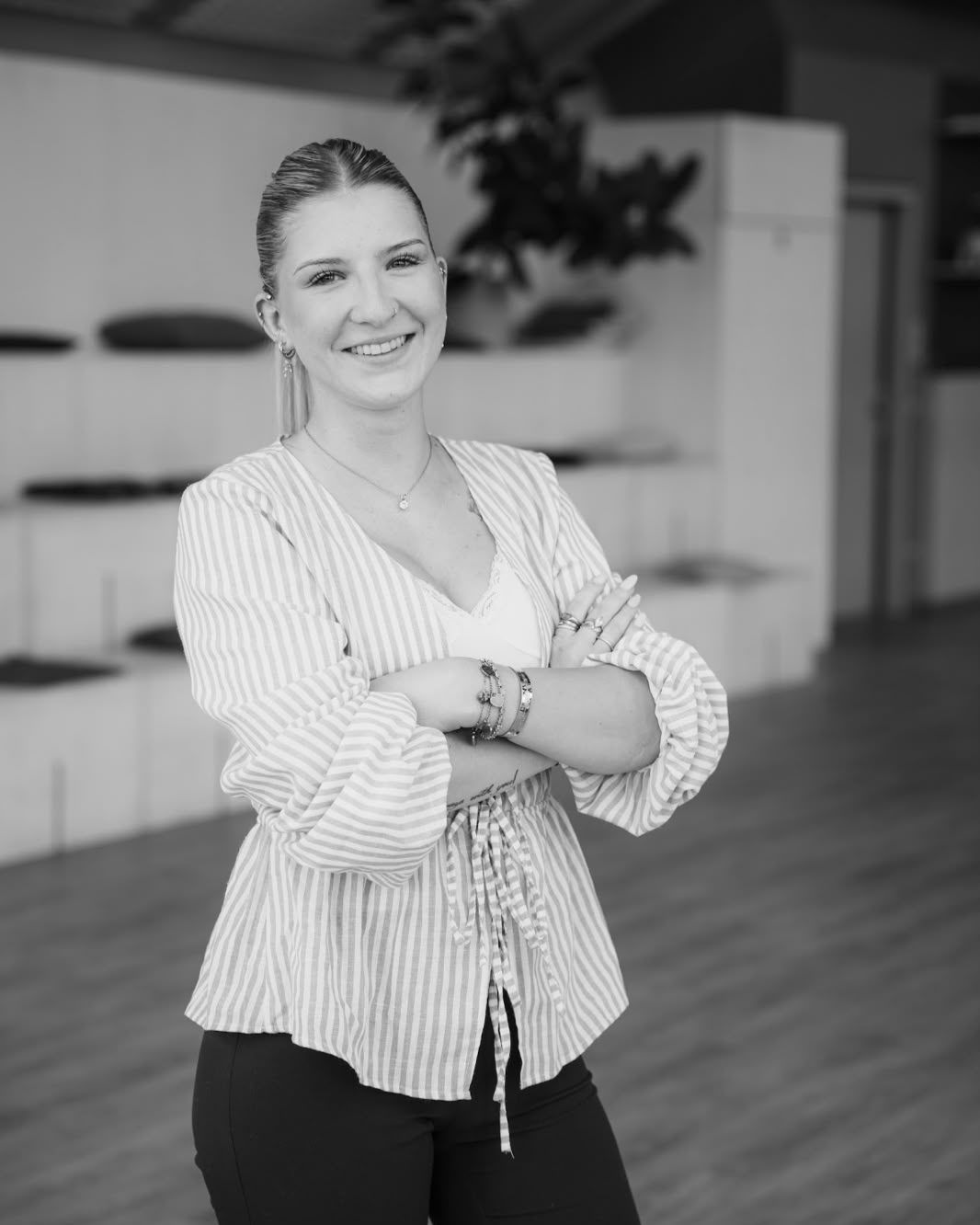 Chiara, content creator and make-up artist at SAM Innovate, smiling with arms crossed