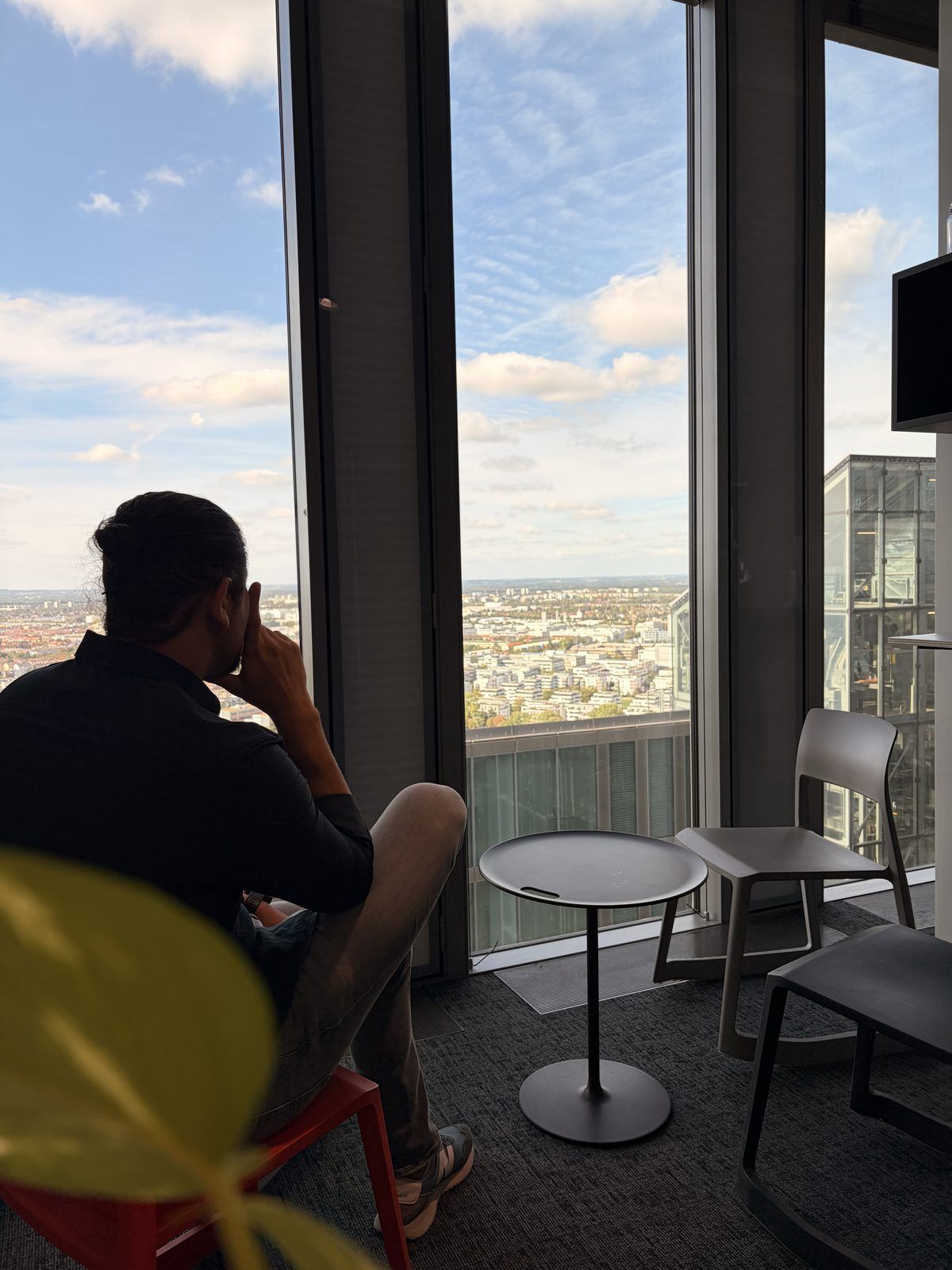 Hüseyin Torun, managing director of SAM Innovate, at a window of the Highlight Towers in Munich